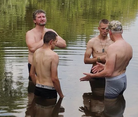 This is a war zone baptismal service. These Ukrainian soldiers had received Jesus as Lord and wished to profess their faith by being baptized in this river. God is present where people call on the name of the Lord, Romans 10:13.
